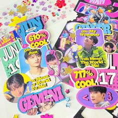 several stickers with the names of korean pop bands on them and confetti sprinkles around them