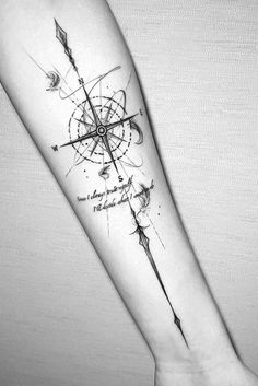 a black and white photo of a forearm tattoo with an arrow on the left arm