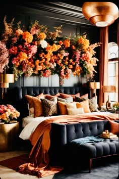 a large bed with lots of flowers on the headboard