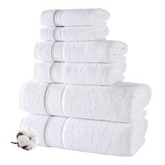 six white towels stacked on top of each other