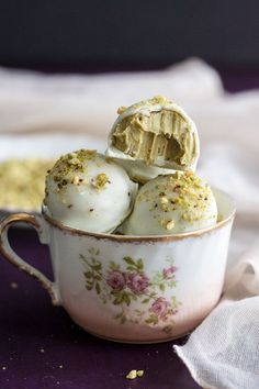 white chocolate pistachio truffles in a tea cup with the title overlay