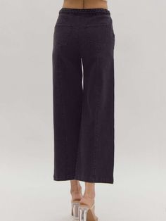 Elevate your style with our versatile and sophisticated high-waisted wide-leg pants. These solid black bottoms feature a unique braided detail at the waist, adding a touch of elegance to a timeless silhouette. The button and zipper closure ensures a secure fit, while the lightweight, woven fabric offers comfort and effortless movement. Designed for versatility, these pants are non-sheer and unlined, making them the perfect choice for both day and night. Pair with your favorite blouse or top for Casual Wide-leg Pants With Seam Detailing, Non-stretch Wide Leg Pants With Button Closure, Black Date Night Outfit, Black Non-stretch Cotton Wide Leg Pants, Black Wide-leg Pants With Button Closure, Black Wide-leg Rayon Pants, Black Dating, Black Wide Leg Pants, Nashville Style