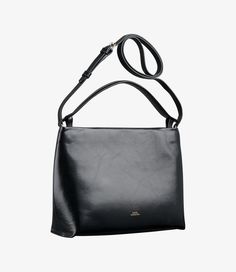 - Elegant minimalist bag. - Magnetic closure. - Removable strap to wear the bag on the shoulder or across the chest. - Handle with embossed A.P.C. logo to carry the bag by hand. - One interior zip pocket. - Embossed goldtone "A.P.C. Rue Madame Paris" logo. Sleek Bags With Detachable Strap For Everyday Use, Sleek Bag With Detachable Strap For Everyday Use, Sleek Shoulder Bag With Detachable Strap For Everyday, Sleek Shoulder Bag With Adjustable Strap For Everyday, Sleek Everyday Shoulder Bag With Adjustable Strap, Sleek Satchel With Detachable Strap For Daily Use, Sleek Everyday Satchel With Detachable Strap, Sleek Rectangular Bag With Adjustable Strap, Modern Business Shoulder Bag With Detachable Strap