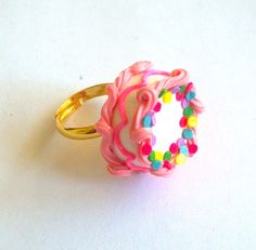 Pink Birthday Cake Ring. $15.00, via Etsy. Cute Pink Round Rings, Playful Pink Rings For Gifts, Playful Pink Rings Perfect For Gifts, Playful Pink Rings As A Gift, Cute Pink Party Rings, Cute Pink Rings For Parties, Adjustable White Rings For Birthday, Handmade Pink Party Rings, Cute Handmade Pink Rings