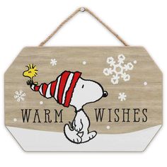 a wooden sign that says warm wishes with a cartoon snoopy holding a yellow bird