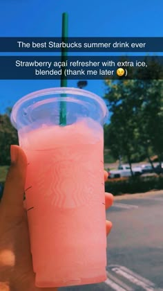 someone is holding up a pink drink with a green straw in it and the caption reads, the best starbuckss summer drink ever strawberry soda refresher with extra ice blended