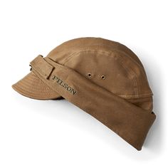 This abrasion-resistant, water-repellent hat is lined with 100% virgin wool sourced from the USA, for sweat-wicking warmth and comfort. It has protective wool neck flaps and earflaps to block wind and driving rain. A D-ring buckle adjustment allows for a custom fit. | Filson Tin Cloth Wildfowl Hat Tan Size 2XL 일본 패션, Dark Tan, Cool Hats, Mode Style, D Ring, No. 2, Custom Fit, Water Repellent, Caps Hats