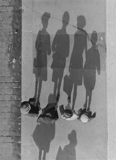 the shadow of several people standing next to each other