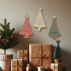 presents are wrapped in brown paper and tied with twine, next to a small christmas tree