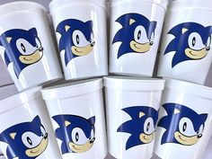 six cups with sonic the hedgehog faces on them