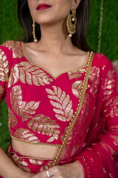 Details BlouseFabric - GeorgetteOrnamentation- Sequin WorkColour - PinkNeck - Sweetheart NeckSleeves - Half Sleeves LehengaFabric - GeorgetteClosure - ElasticatedLength - Ankle length DupattaFabric - Net Delivery Time: 8 to 10 Working DaysThe model is wearing XS Size Description This stunning rani pink lehenga outfit is ideal for use at parties and festivals, both during the day and at night. A rich border of sequin embroidery makes the lehenga more elegant. The blouse features the same embroide Pink Lehenga Outfit, Rani Pink Lehenga, Lehenga Outfit, Shaurya Sanadhya, Georgette Material, Georgette Lehenga, Bride Jewelry Set, Rani Pink, Long Gown Design