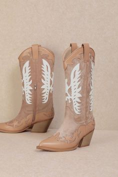 Embrace a feminine and flirty style at your next rodeo with the IDALY - Pastel Western Mid Boots. Crafted from smooth faux leather, these mid-calf boots are perfect for any festival scene, featuring a classic pointed-toe and intricate Western-inspired detailing in soft pink and beige hues. The curved topline with side pull tabs ensures easy on-and-off, while the wood-look stacked heel adds just the right amount of height. These boots combine charm and practicality, making them a must-have for th Trendy Leather Mid-calf Spring Boots, Western Knee-high Boots For Spring, Trendy Mid-calf Boots For Spring, Trendy Pointed Toe Mid-calf Boots For Spring, Spring Trendy Pointed Toe Mid-calf Boots, Spring Wide Calf Faux Leather Boots, Trendy Faux Leather Boots, Trendy Summer Faux Leather Boots, Knee-high Faux Leather Boots For Spring