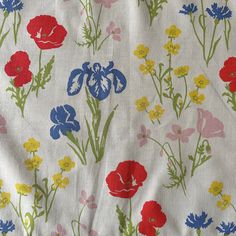 an image of colorful flowers on white fabric