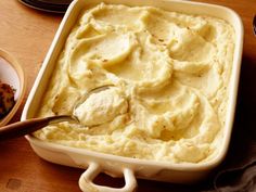 a pan filled with white batter on top of a wooden table