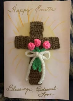 a crocheted card with a cross and flowers on it that says happy easter