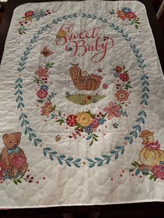 there is a baby quilt on the table