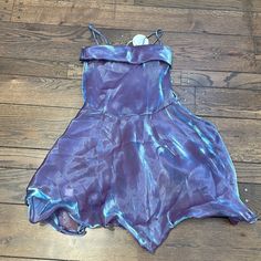 A Magical Dress Meant For A Sugarplum Fairy (Or A Speak Now Girlie) In An Of-The-Moment Iridescent Sheer Purple With Retro Foldover Neckline And Dramatic Skirt. The Skirt Has Wire In The Hem, And Can Be Styled Inwards, Like A Y2k Bubble Hem, Or Flared Outwards. Perfect For Holiday Parties, Wedding Guests, Date Nights, Vacations, Photoshoots, Prom, And Other Special Events. Speak Now Party, Ethereal Dress Goddesses, Dramatic Skirt, Sugarplum Fairy, Iridescent Dress, Magical Dress, Space Fashion, Party Mini Dress, Theme Dress