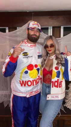 a man and woman dressed up as nascar drivers