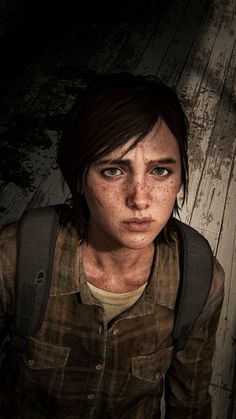 the last of us character with freckles on her face and chest, standing in front of a wooden wall