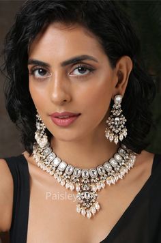 Get your hands on the Victorian Polki necklace set embedded with polki and shell pearls is here to accentuate your feminine grace. The Victorian necklace with pretty drop earrings is here to bejewel your neckline that is beautifully handcrafted by the artisans of India. Spruce up your look with our magnificent polki and pearls necklace paired with quintessential earrings  Necklace Closure - Adjustable Dori Earrings Closure - Push-Back Style Tip - Created out of our fascination with radiance, bling, and luxury. These designs embody the luminosity of the heavens, paired with contemporary hues and loads of luxury. You'll see the unusual play of textures and hues, some soulful pairing of contrasts, like gold and silver, and dreamy details that will offer much versatility. We would love to see Fusion Kundan Jewelry With Pearl Drop, Silver Bridal Necklace With Pearl Drop For Diwali, Diwali Bridal Necklace With Pearl Drop In Silver, Diwali Bridal Necklace With Pearl Drop, Silver Pearl Kundan Necklace For Reception, Silver Kundan Necklace With Pearl Drop, Silver Kundan Bridal Necklace With Pearl Drop, Silver Kundan Bridal Necklace With Pearl Chain, Festive Silver Kundan Necklace With Pearl Drop