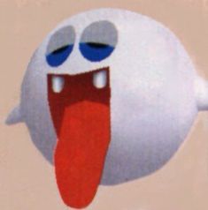 an animated white ball with blue eyes and red tongue