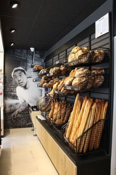 breads and pastries on display in a bakery