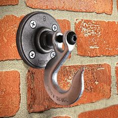 there is a hook on the brick wall