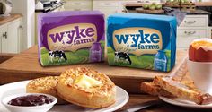 two packages of wyke farms bread and jam are on the kitchen counter top