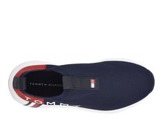 Lightweight and breathable fabric upper, Easy slip-on entry, Classic round toe, Cushioned EVA insole, Durable synthetic outsole, Tommy Hilfiger® branding details | Women's Tommy Hilfiger Aliah Sneakers in Navy Size 9 Medium Shoe Carnival, Tommy Hilfiger Women, Slip On Sneakers, Breathable Fabric, Womens Sneakers, Tommy Hilfiger, Slip On, Size 7, Size 10