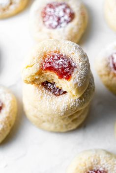 powdered sugar cookies with jelly filling on top