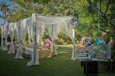 an outdoor wedding setup with tables and chairs