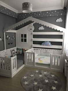 a child's room with two cribs and a rug on the floor