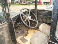 the interior of an old truck with no steering wheel