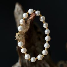 This beautiful Freshwater pearl bracelet ranges between 7-8mm in size and consists of beautiful and lustrous pearls in AAAA+ quality. All pearls in this bracelet are round and are strung with silk thread and double-knotted between each pearl. Known as the 'icon' of cultured pearls, Freshwater pearls have graced the necks, ears, fingers, and wrists of women for decades. Huge Tomato imports their Freshwater pearls from the Freshwater rs of Japan, grown in the Pinctada fucata oyster. All of our Fre Pearl White Beaded Round Pearl Bracelet, Beaded Pearl White Round Bracelet, Gold Pearl Bracelet With Pearl Drop, Pearl White Bracelets With 8mm Pearl Beads, Pearl White Baroque Pearl Bracelet With Round Beads, Pearl Bracelet With 8mm Beads, Baroque Pearl Bracelet With Pearl Drop, Pearl Beaded Bracelets With 8mm Beads, Pearl White Baroque Pearl Bracelet