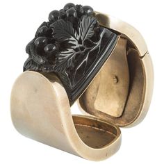 A stunning and highly stylish French cuff, with matching belt (the buckle is made also from carved Galalith, with the same design as the cuff), a wonderfully smart combination not really seen these days. The black Galalith pieces (the French equivalent to Bakelite) are carved into foliage and fruits, with a small squirrel (or fox), seeking out the fruit. Both are set into a soft gilded metal (the gilding on the bangle shows more sign of wear, which adds to its quality, the buckle is almost pristine), and one side of the cuff lifts to allow the wearer to place it on their wrist. The bangle worn by itself is such a statement piece, enhanced further if worn with the belt. Both belt and bangle are signed 'Made In France' and with the logo 'BJ' , not easy to decipher. Such strong French style! Bakelite Bracelets, Bakelite Bangles, Style Français, French Cuff, Black Jewelry, Victorian Jewelry, Metal Clay, Art Accessories, Jewellery And Watches