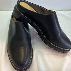 Size 11 Black Lug Sole Mules/Clogs Never Worn. Extreme Cushion Inside. Black Flat Heel Clogs For Spring, Casual Platform Slip-ons For Work, Black Closed Toe Slip-ons With Leather Footbed, Black Closed Toe Slip-ons With Cushioned Footbed, Classic Flat Clogs With Rubber Sole, Flat Heel Clogs With Cushioned Footbed For Work, Cushioned Flat Heel Clogs For Work, Casual Synthetic Mules For Work, Black Flat Clogs With Cushioned Footbed