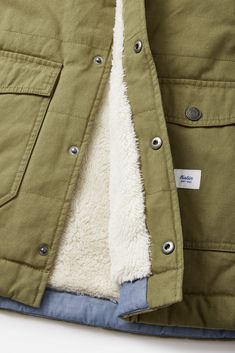 The Yukon Vest is a 100% cotton snap-down vest made from a cotton canvas shell that offers a custom sherpa body liner,& front pockets. 100% cotton canvas shell 100% cotton corduroy upper chest, shoulders and collar Front snap closure Front pockets Sherpa liner | Yukon Vest Men's Size Small Cotton in Olive by Katin Vests Mens, Shoe Gifts, Basic Shirts, Top Graphic Tees, Down Vest, Surf Shop, Swim Shorts, Bottoms Pants, Snap Closure