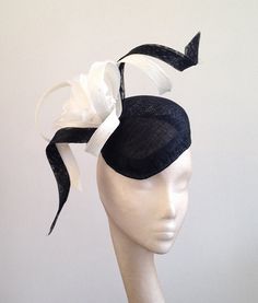 Striking Large Headpiece Black Pointed Beret with Black and White Twists and White Flower Very striking piece, it can be made in other colours please contact me for details Made to order it takes 2-3 weeks to make - if you need it sooner please contact before ordering - Thanks  Held on with a hat elastic it sits to the right hand side if the head Great for events such as a wedding, race meetings such as Royal Ascot, Cheltenham, Ebor, Goodwood, Melbourne Cup, Kentucky Derby or any hat wearing occasion.  Completely hand blocked and hand stitched. Fitted Black Headband For Spring, Spring Fitted Black Headband, Fitted Black Headband For Summer, Fitted Black Summer Headband, White Headpiece, Gold Veil, Melbourne Cup, Royal Ascot, Wedding Hats