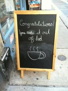 a chalkboard sign with writing on it that says congratulations you made it out of bed