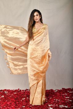 Gold-ish Peach Handwoven Pure Tissue Silk Striped Chanderi saree paired with Banarasi brocade blouse Peach Zari Work Saree For Navratri, Peach Saree With Zari Weaving For Wedding, Peach Wedding Saree With Zari Weaving, Traditional Peach Pre-draped Saree For Festive Occasions, Festive Orange Pre-draped Saree, Peach Art Silk Traditional Wear With Pallu, Art Silk Saree With Dupatta In Peach, Peach Art Silk Saree With Dupatta, Peach Unstitched Blouse Traditional Wear For Diwali