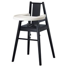 a black and white highchair with a seat on it's backrest