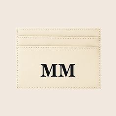 a white card holder with the word mm printed on it's front and back