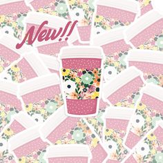 a pink coffee cup surrounded by lots of stickers with the words new on it