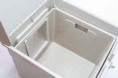 an open white refrigerator with its door wide open