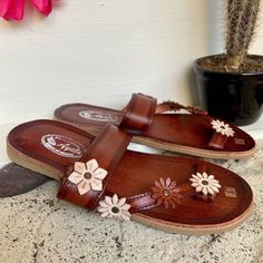 Beautiful handmade Huaraches. They are the best quality that can be found in huaraches. They are completely handmade, making them totally unique in style. These beautiful shoes can be worn with a dress as well as with a pair of jeans and you will look unique and fashionable. How to order your size: Example, if you wear size 6.5 ask for size 6. If you wear size 6 ask for 6. The huarache molds to your feet with use, they stretch. Note: Size changes are accepted. If you need a change in numbering, Artisan Brown Sandals For Spring, Artisan Huarache Sandals For Spring, Handmade Leather Huarache Sandals For Beach, Summer Beach Huaraches With Leather Sole, Traditional Brown Huarache Sandals For Vacation, Brown Huarache Sandals With Leather Sole, Brown Toe Post Huarache Sandals With Leather Sole, Artisan Handmade Huarache Sandals For Summer, Bohemian Sandals With Rubber Sole For Festival