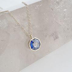 This luminous, crystal pendant has all the right angles that lend to just the perfect amount of shimmer. Each angle reveals another layer to the mystic, iridescent, synthetic blue alexandrite. Length: adjustable between 18 -21". Our materials make for an amazing, high quality, seamless, jewelry piece with longevity. Our necklaces are plated with 18k gold, 18k rose gold, or rhodium and finished with a protective coating. A little secret we’ll keep between us: it looks way more than it costs. North Star Necklace, Blue Crystal Necklace, The Mystic, Rose Blue, Between Us, Rose Necklace, Heart Locket, Rose Gold Necklace, Silver Roses