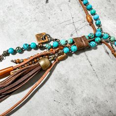 Turquoise Clutch Necklace Horn and Deerskin Tassel. Hand crafted by Amy Kaplan. Amy is a truly talented artisan who has been hand crafting high quality custom jewelry for cowgirls with discriminating taste. You'll have a unique custom piece of western jewelry that stands out from the crowd. Turquoise, golden and olive horn beads with natural horn feather shaped pendant and deerskin tassel. Western Diy Jewelry, Western Diy, Deer Skin, Western Jewelry, Style Jewelry, Western Style, Country Girls, Bourbon, Western Fashion