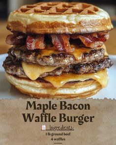 a bacon and cheese waffle burger on a white plate with a piece of wax paper