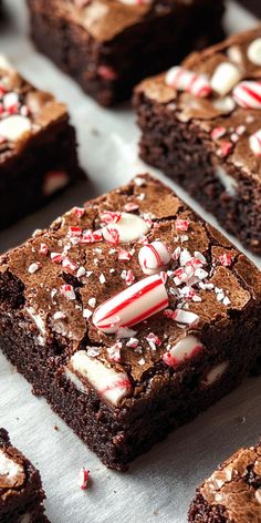 chocolate brownies with candy canes and peppermint on top are ready to be eaten