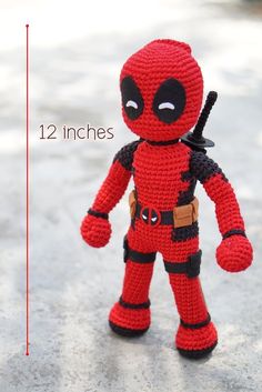 a crocheted deadpool doll is shown with measurements